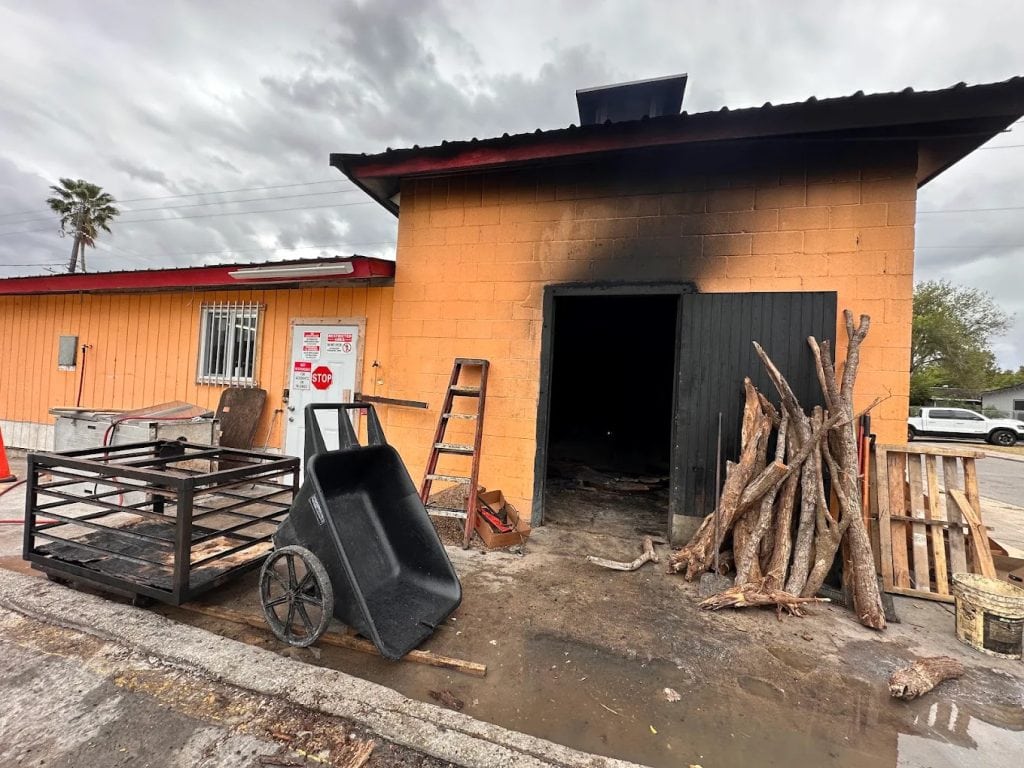 The smoke pit at Vera’s is where all the magic happens, slow-cooking meats to perfection. Credit: Kitty