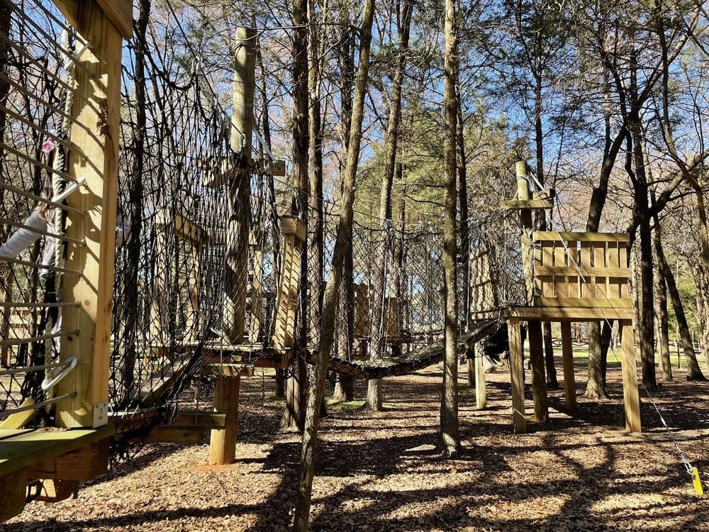 The Out On A Limb Children’s Area features wooden and netted play structures closer to the ground, perfect for kids ages 4–7. Credit: Jadine R.
