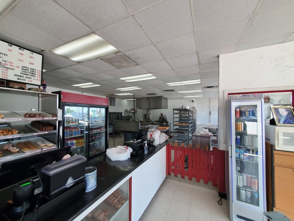 Beside the counter, the in-house bakery shows where every donut is made fresh daily. Credit: Troy S.