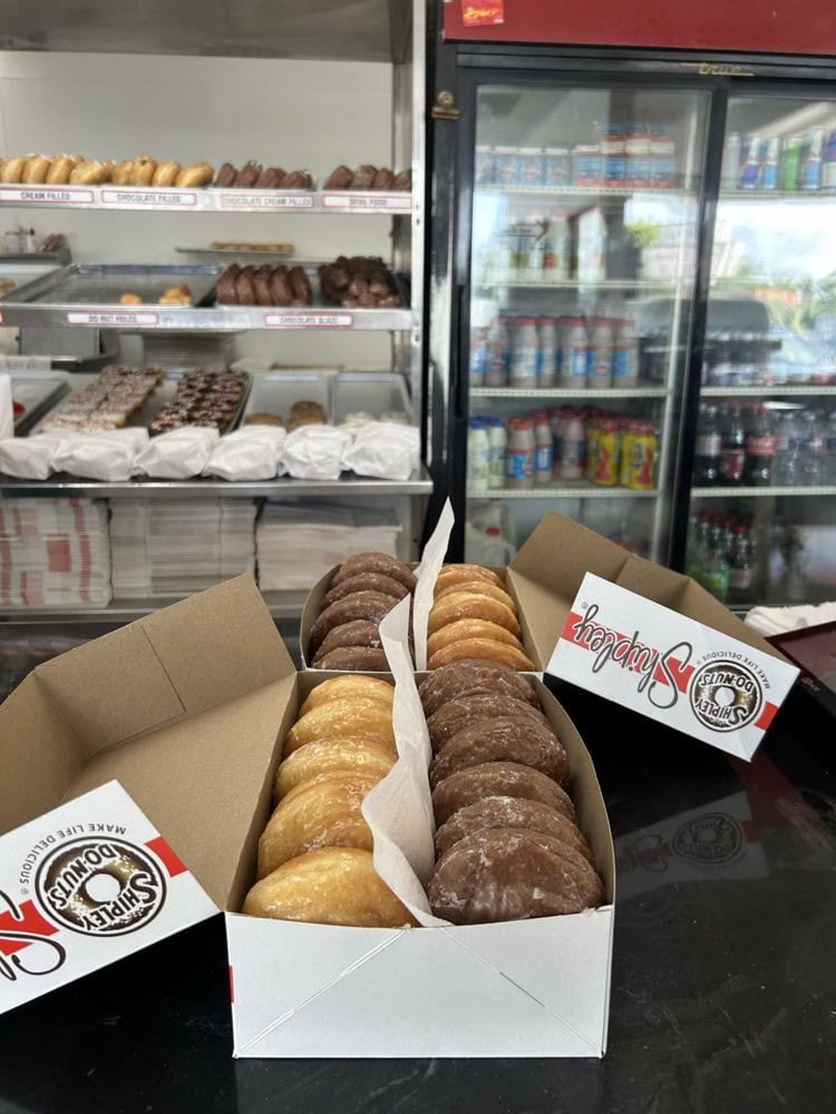Two boxes of Shipley’s originals and chocolate-glazed donuts highlight their most popular offerings. Credit: Victor T.