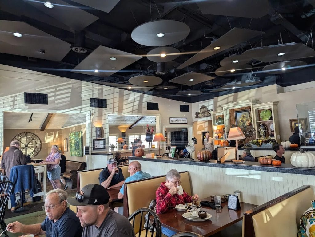 Inside Buttermilk Café feels spacious yet cozy, with warm lighting, comfortable seating, and familiar faces among the local regulars. Credit: ROBERT LOUGH