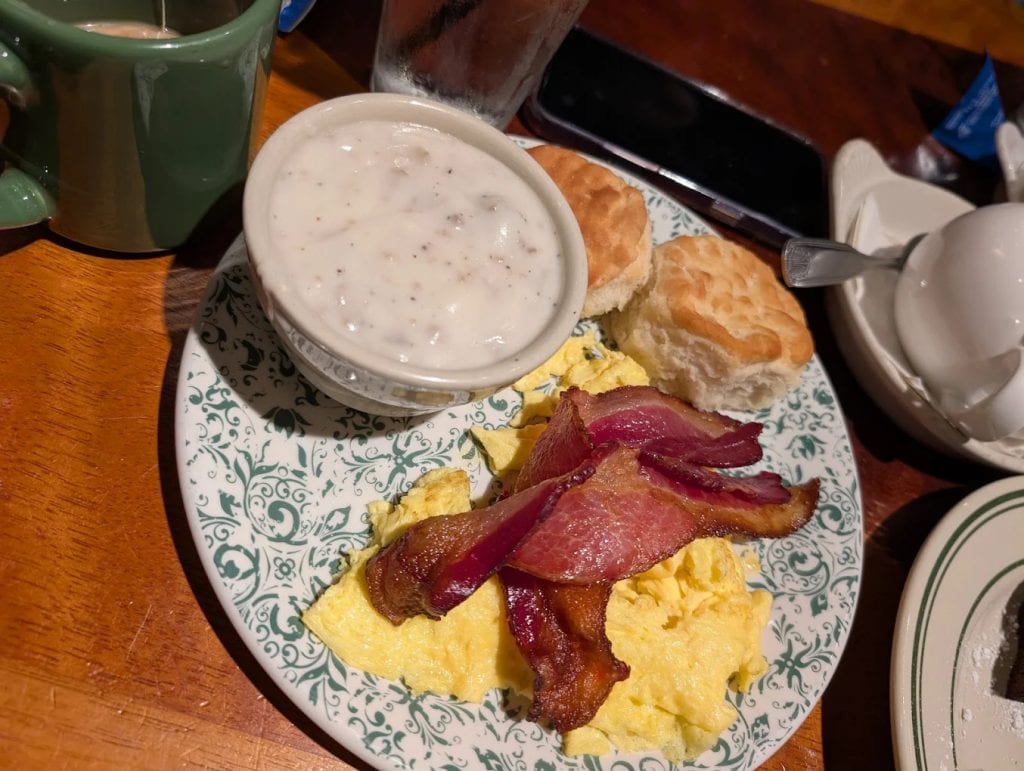 The country breakfast at Buttermilk Café serves eggs, biscuits with gravy, and bacon, a timeless classic done right.Credit: Bryan Bateman