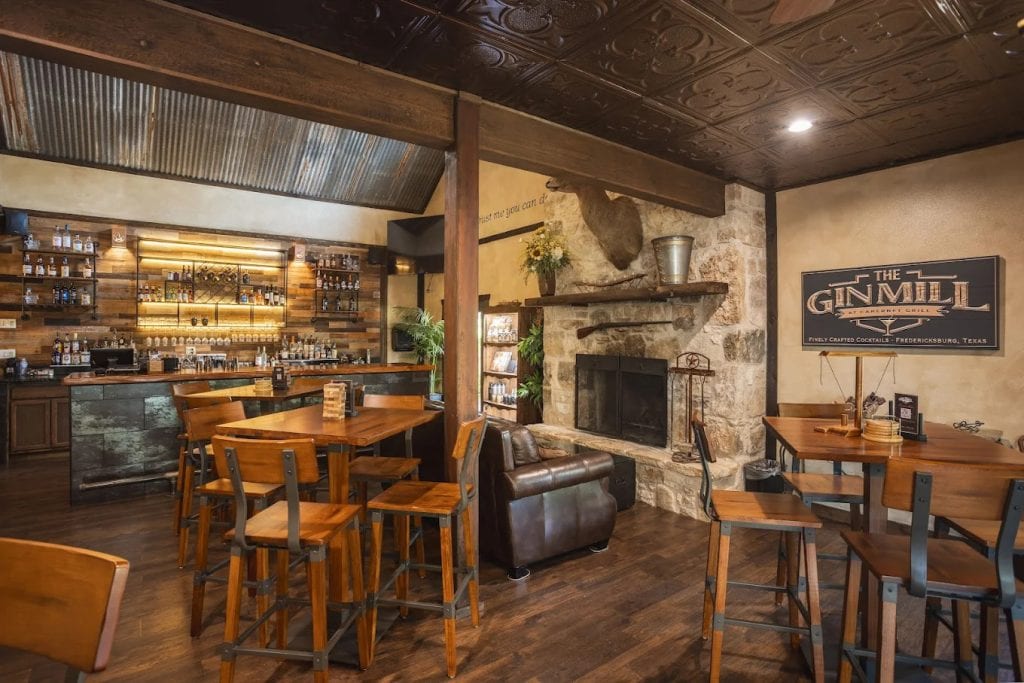 Inside Gin Mill Lounge, rustic wooden interiors set the mood for enjoying cocktails and drinks in a relaxed atmosphere. Credit: Gin Mill Lounge