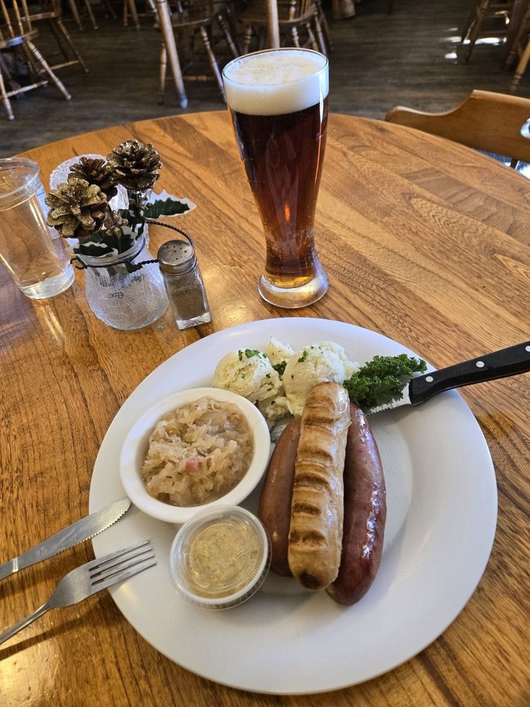 The Burger Meister Platte pairs a sausage sampler with potato salad, sauerkraut, and Oktoberfest draft beer. Credit: Brian B.