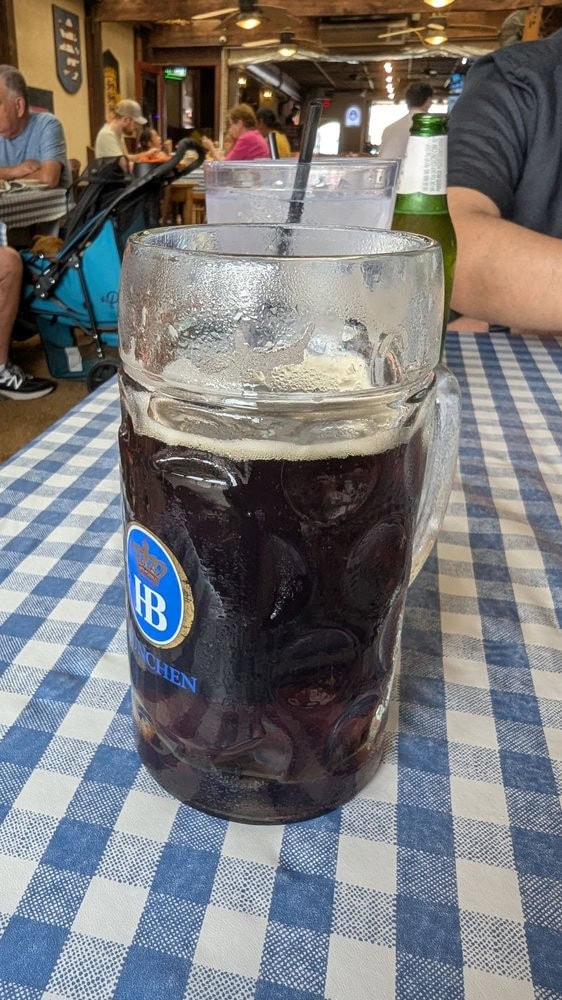 A huge glass of Dunkel beer completes the authentic German dining experience. Credit: Dexter V.