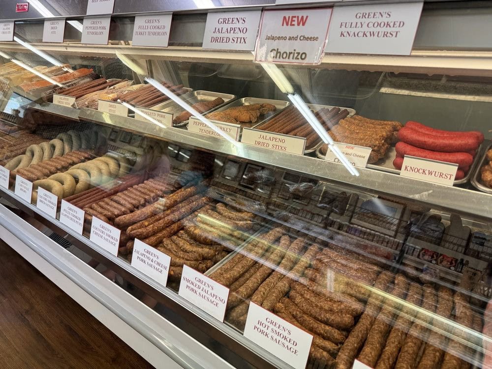 Endless varieties of sausages line the counters, making Green’s a paradise for meat lovers. Credit: Mike H.