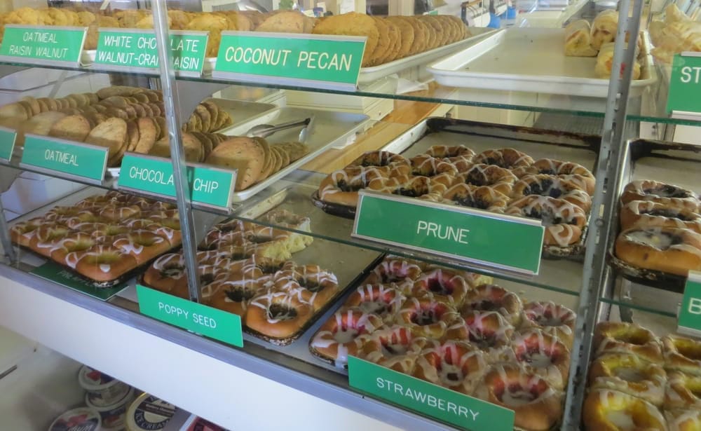 A baked goods display case offers savory and sweet treats fresh from the oven. Credit: Tim C.