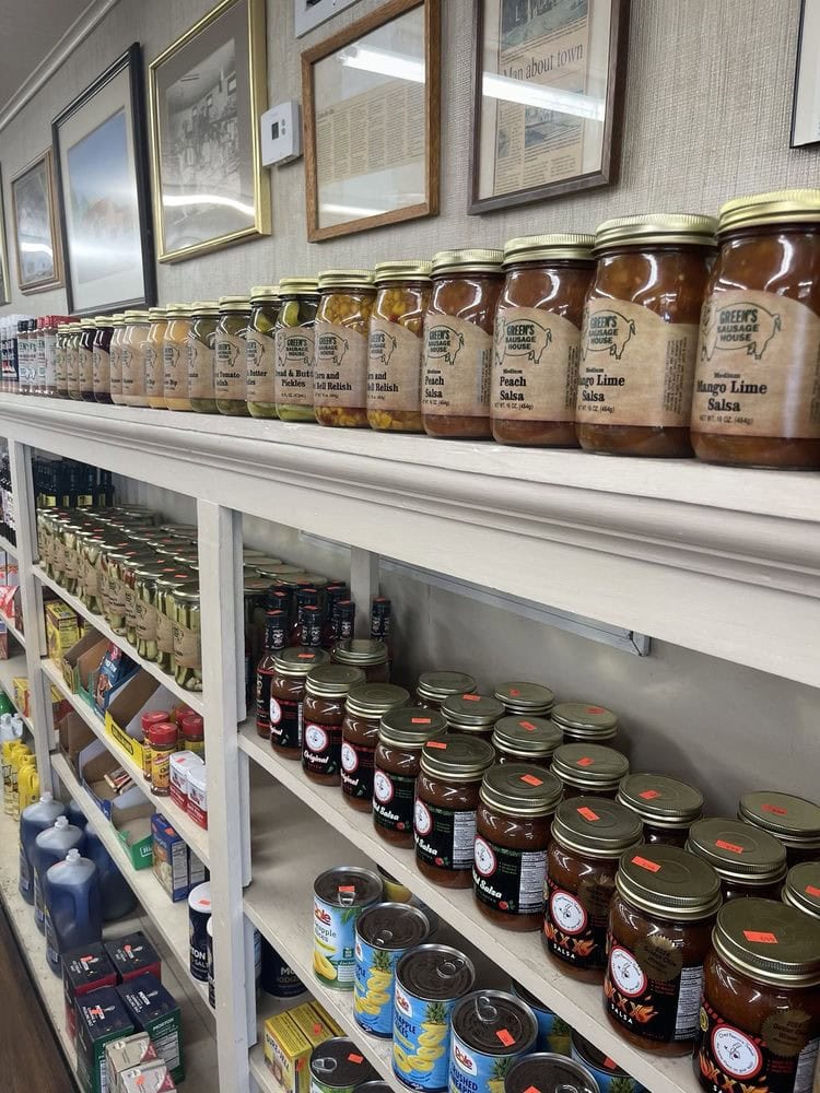 Shelves stocked with country goods—jars, canned items, salsa, pickles, and more—add to the market-style charm. Credit: Tate V.