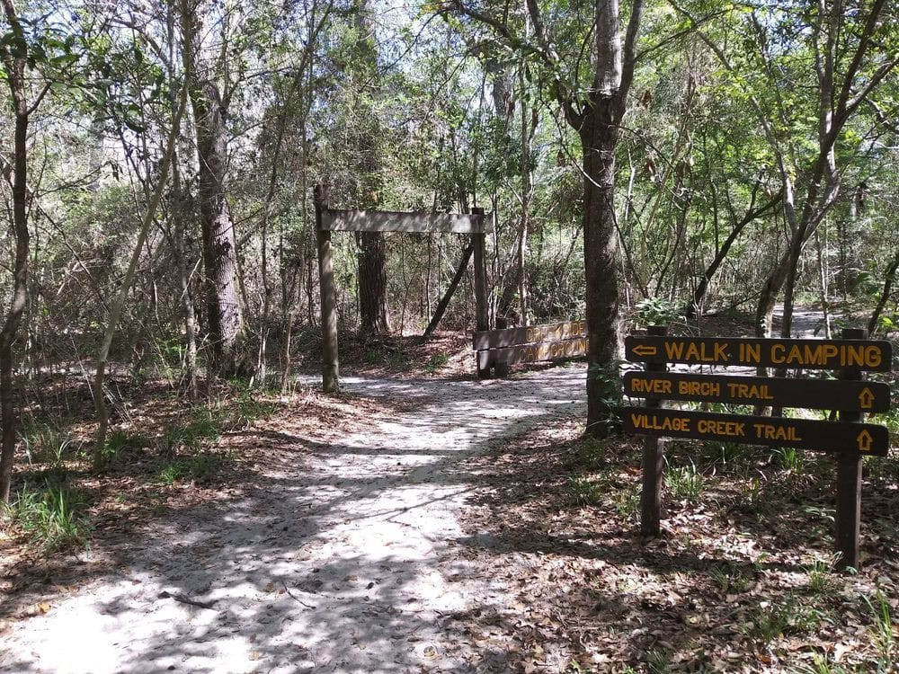 Wooden signs along the trails point the way, guiding hikers through the forest paths. Credit: Maria W.