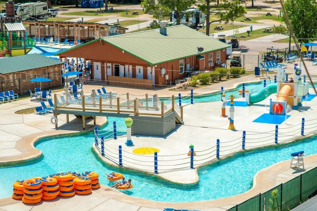 Jellystone Park offers endless fun with a huge lazy river, slides, picnic tables, and lounging chairs all in one view. Credit: Jellystone Park™ Waller