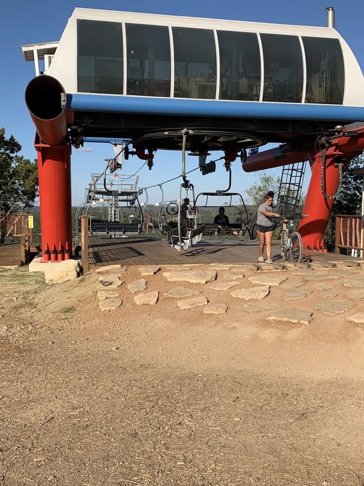 At the summit, a platform awaits riders and bikes, the starting point for adrenaline-pumping descents. Credit: Garry H.