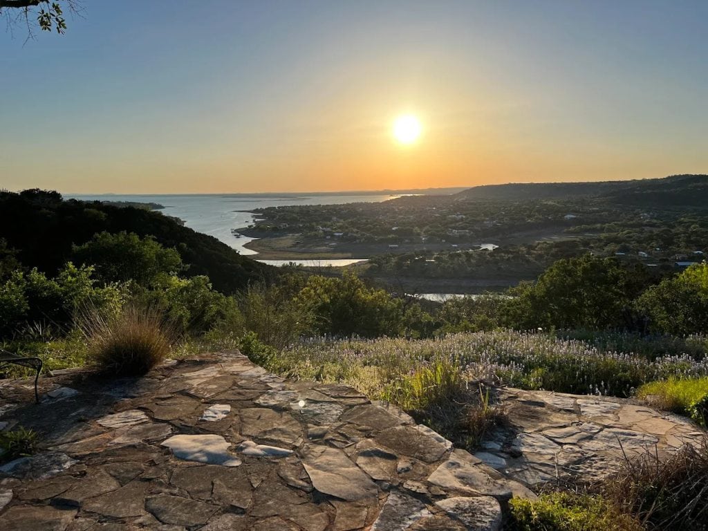 From the summit, Lake Buchanan shines in the distance, a breathtaking backdrop for bikers. Credit: Kevin Baker