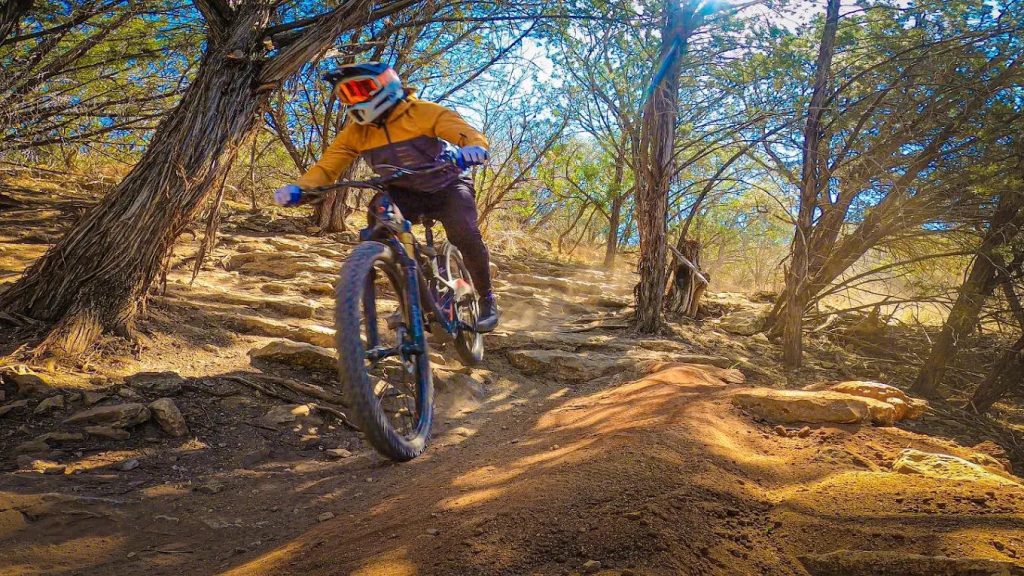 A biker winds through one of the park’s challenging terrains, showcasing the thrill of the ride. Credit: David Acevedo