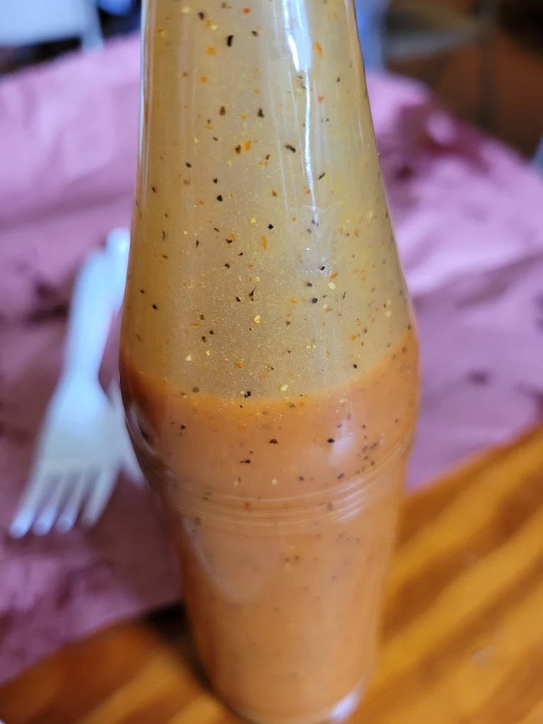 City Market’s mustard-based barbecue sauce is legendary—liquid gold on every plate. Credit: Kenneth