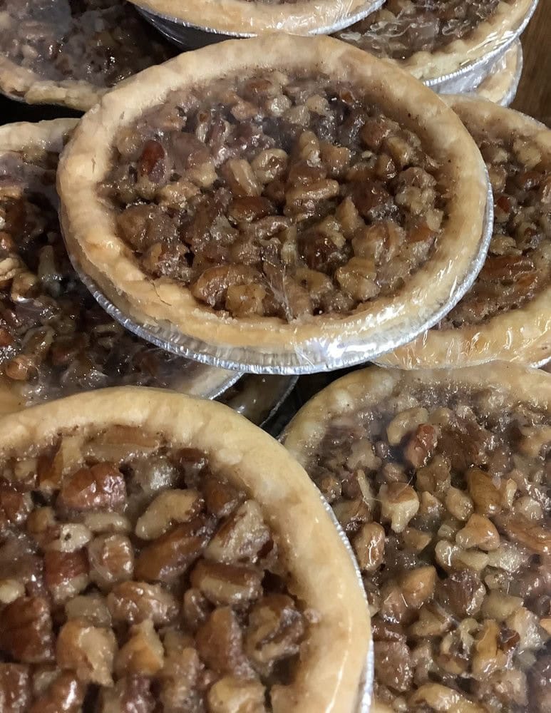 Homemade pecan pies round out the menu, completing the full Texas dining experience. Credit: Luling City Market