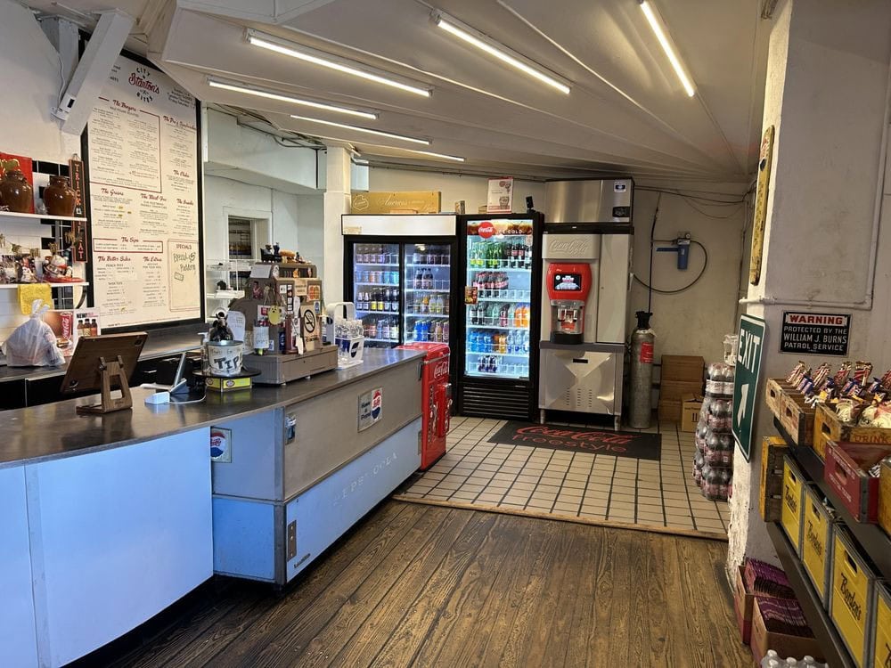 The cashier area is straightforward and practical, focused on serving great food rather than aesthetics. Credit: Jon B.