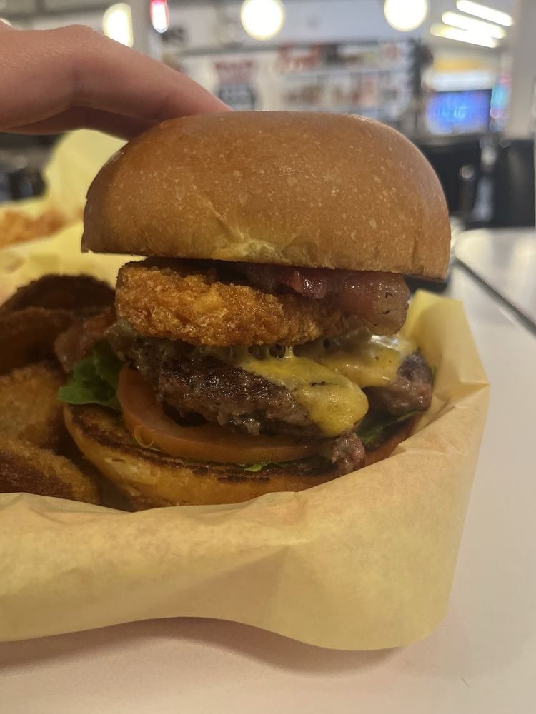 The Miss Piggie burger mixes bacon into the beef patty and tops it with candied bacon—true bacon overload. Credit: Adrianna T.