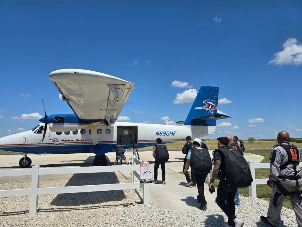 Skydivers board the plane, gearing up for the ultimate adrenaline rush. Credit: Ramiro Galvez