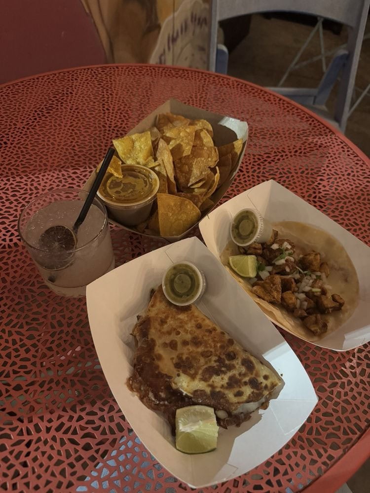 Quesadilla, chicken taco, chips and salsa from Asador Tacos pair beautifully with cocktails from Las Perlas. Credit: Melissa H.