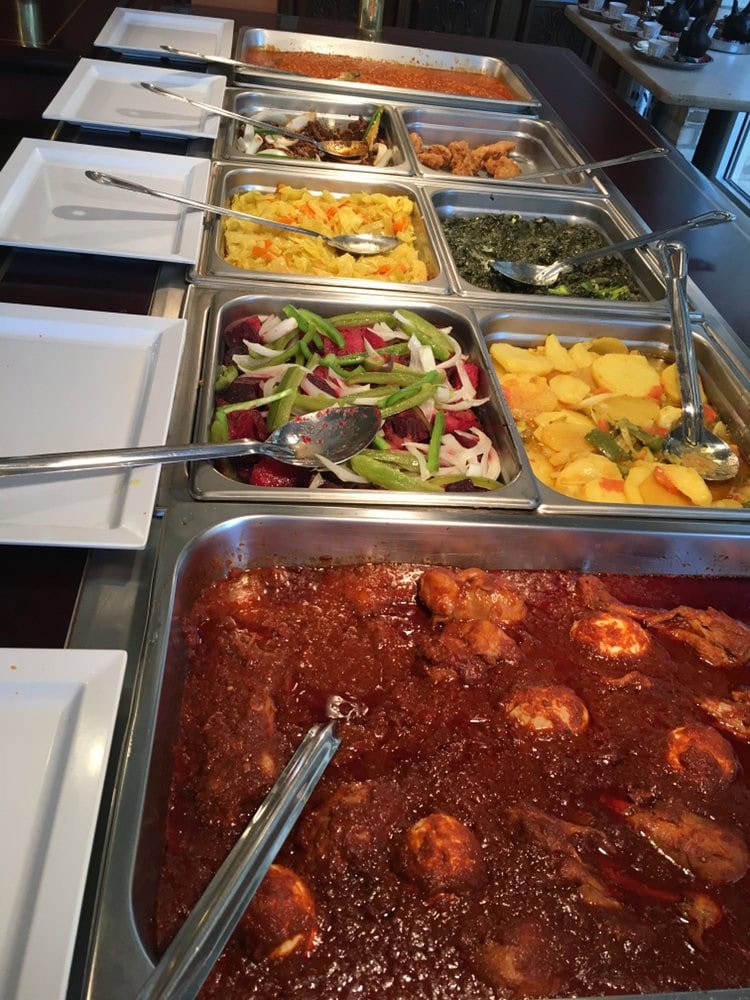 The lunch buffet features 12 different items, satisfying meat lovers and vegetarians with gluten-free and vegan choices. Credit: Taste of Ethiopia