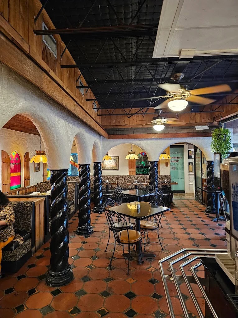 Inside, Indian décor and spacious seating with tables and booths create a welcoming atmosphere. Credit: Bharath C