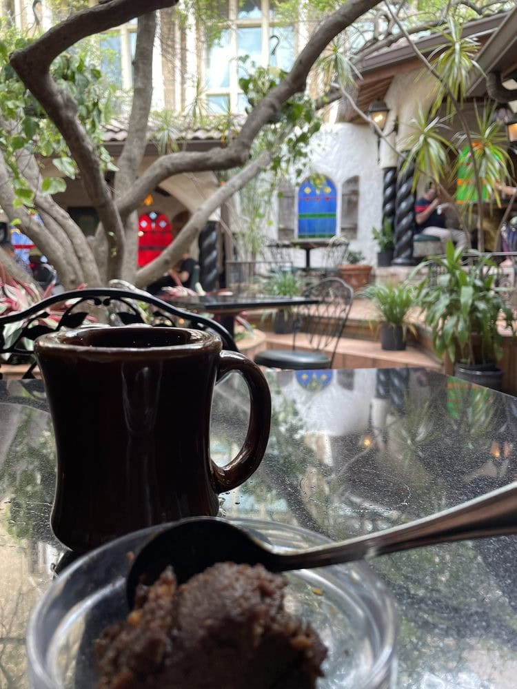 Bread pudding and a hot beverage in the courtyard make for a relaxing treat. Credit: David B.