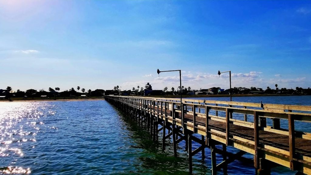 The boardwalk at King Fisher Beach lets you stroll right across the water, blending nature and relaxation. Credit: Gene Brown