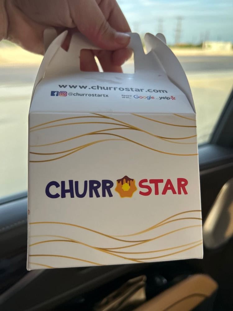 The Mini Churros Box comes in a cute white takeout package with 15 bite‑sized churros. Credit: Odalys M.