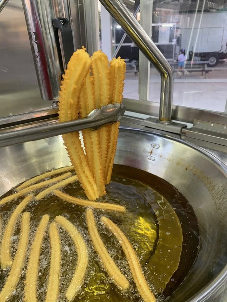 Traditional churros come straight out of the fryer, sometimes with a two‑for‑one promo that doubles the joy. Credit: ChurroStar