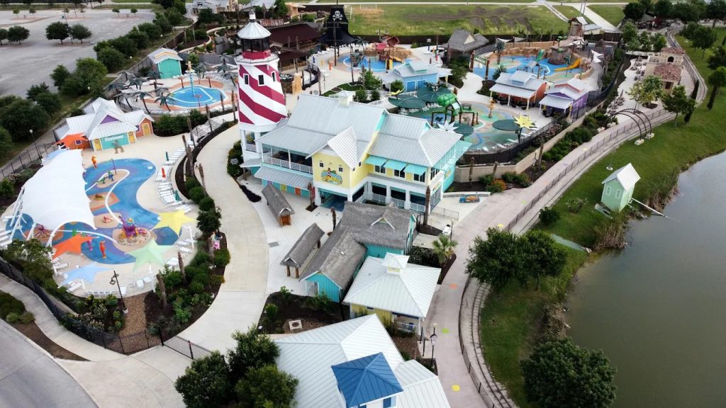 An aerial view of Morgan’s Inspiration Island shows expansive pools and splash pads designed to be inclusive for everyone. Credit: Don M