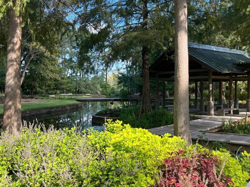 A lake with a gazebo and tall trees showcases how beautifully the park preserved its natural setting. Credit: Friends Of Mercer Botanic Garden - The Mercer Society