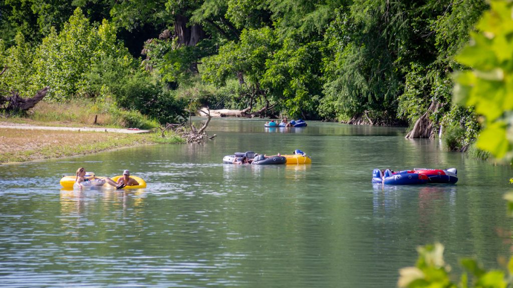 Guests float down the San Marcos River with easy access from Don’s Fish Camp, the ultimate tubing spot. Credit: Don's Fish Camp