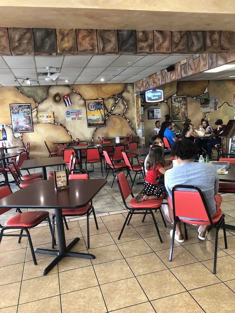 Inside Tropicana, the straightforward Cuban‑inspired décor and clean setup focus on food over aesthetics. Credit: Peggy W.