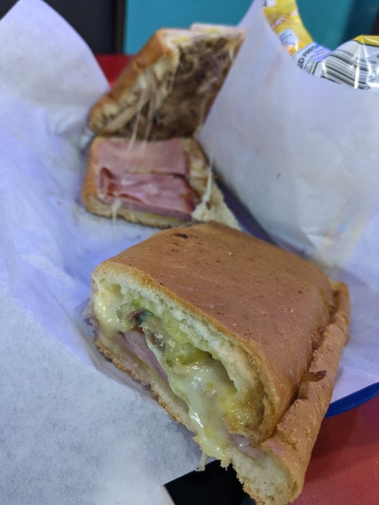 Their Cubano, filled with pulled pork, ham, cheese, and sauces, is the restaurant’s best seller. Credit: Eina D.