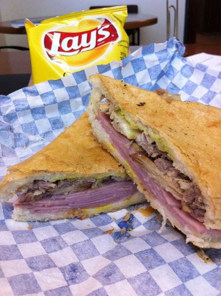 Another look at the Cuban sandwich shows perfect layers, served with a bag of Lay’s chips. Credit: Thomas B.