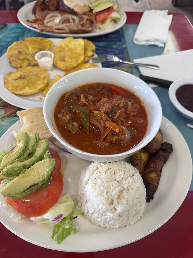Ropa vieja, a classic Cuban beef stew, is served with rice and vegetable sides for homestyle comfort. Credit: Viv MC