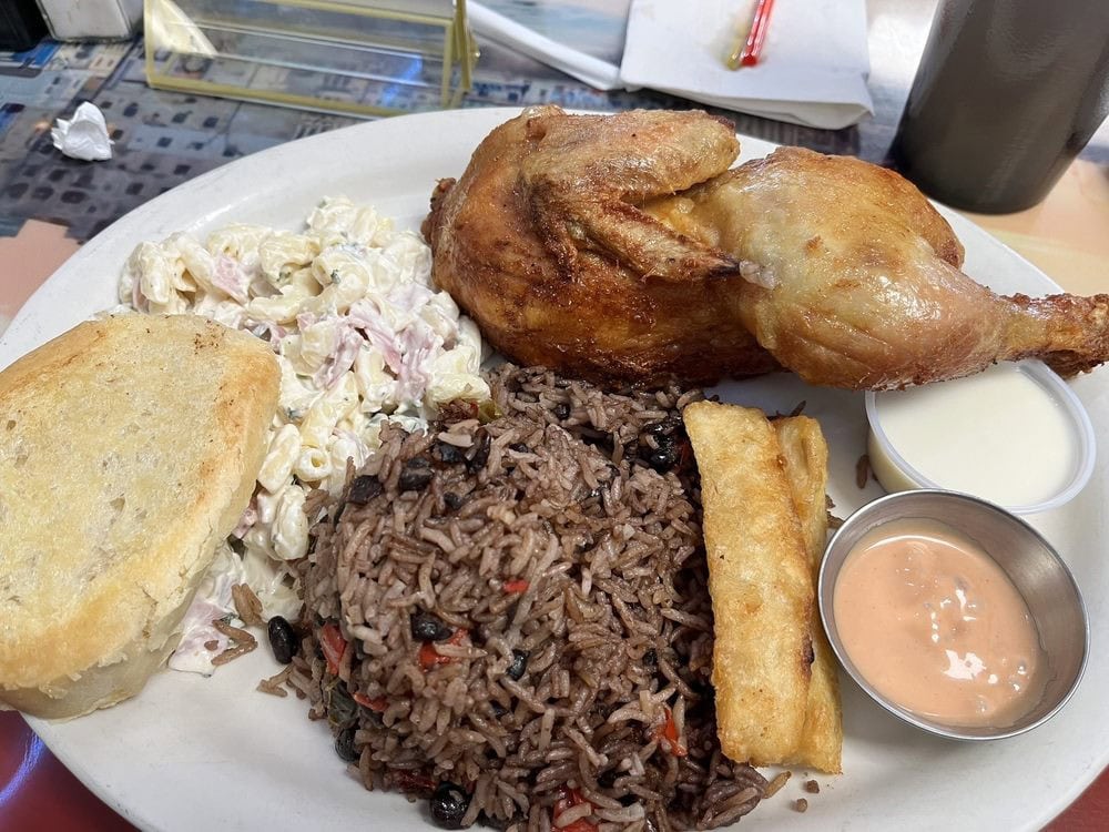 Pollo frito is served with congri (Cuban rice with beans), bread, and macaroni salad. Credit: Anthony N.
