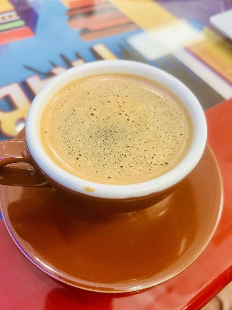 A warm café con leche offers a classic Cuban coffee experience. Credit: Natalie K.