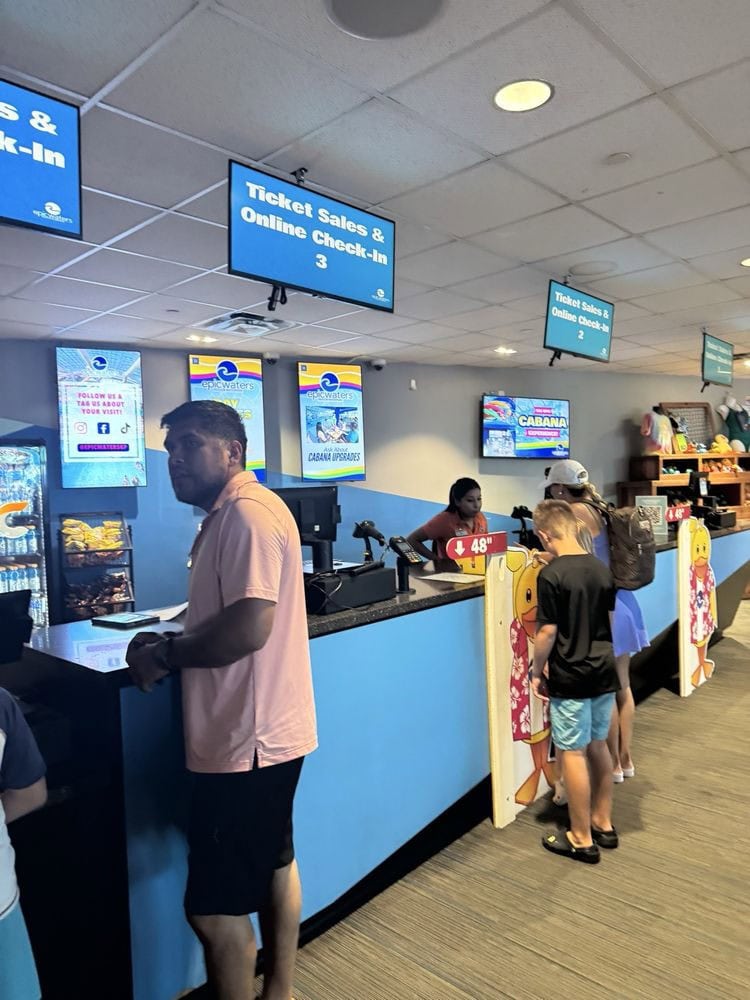 The lobby provides smooth check‑ins, snack options, and online processing, with merchandise on display. Credit: Mae T.