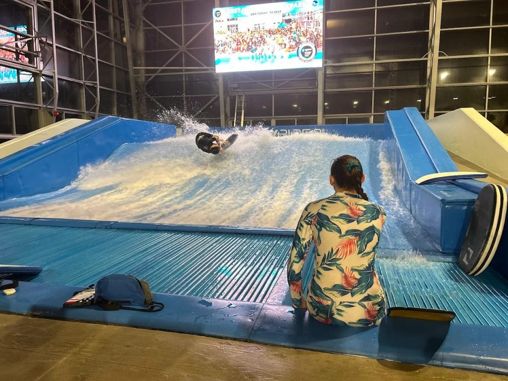 The FlowRider surfing simulator lets guests experience thrilling wave‑riding indoors. Credit: mason weathery