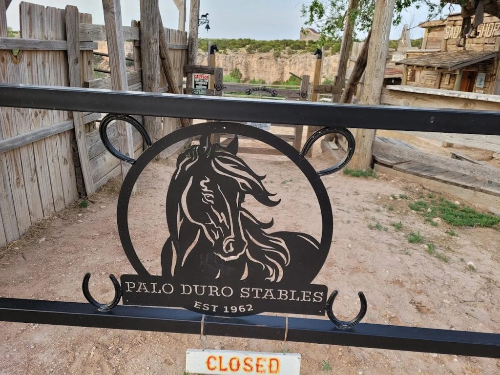 The Palo Duro Riding Stables sign marks one of the family-run stables serving visitors since 1962. Credit: Michelle Jobe