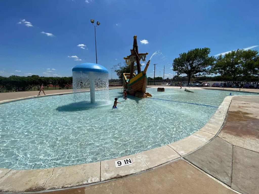 A pirate ship centerpiece sits right in the middle of the pool, with shallow waters designed for kids’ safety. Credit: Ayda Mondragon