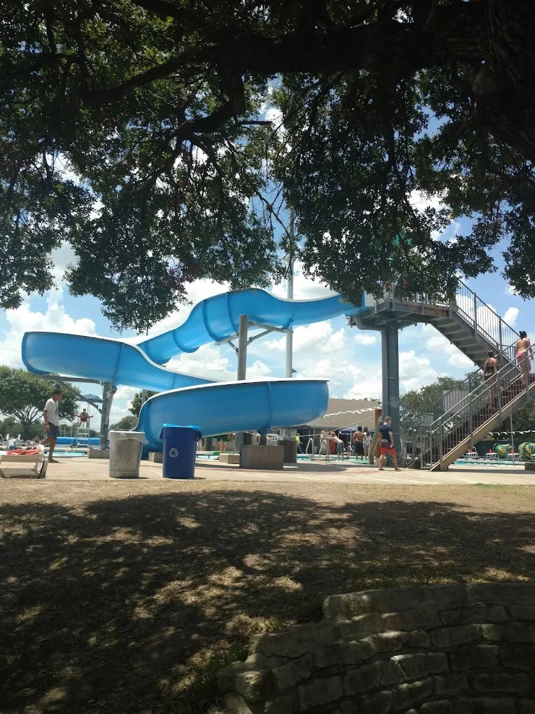 The massive water slide at Micki Krebsbach rises high, with two flights of stairs leading to the thrilling drop. Credit: Mindi M