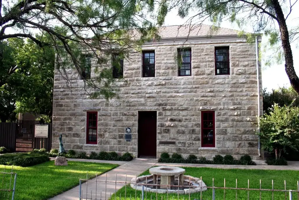 Historic stone façade of the Old Jail Art Center, showcasing its 19th-century jail construction and the site’s rich Texas history. Credit: The Old Jail Art Center
