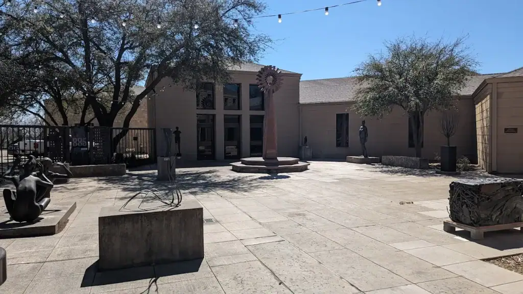 Courtyard of the Old Jail Art Center, where sculptures and outdoor installations greet visitors even before stepping inside. Credit: Raymond Taylor