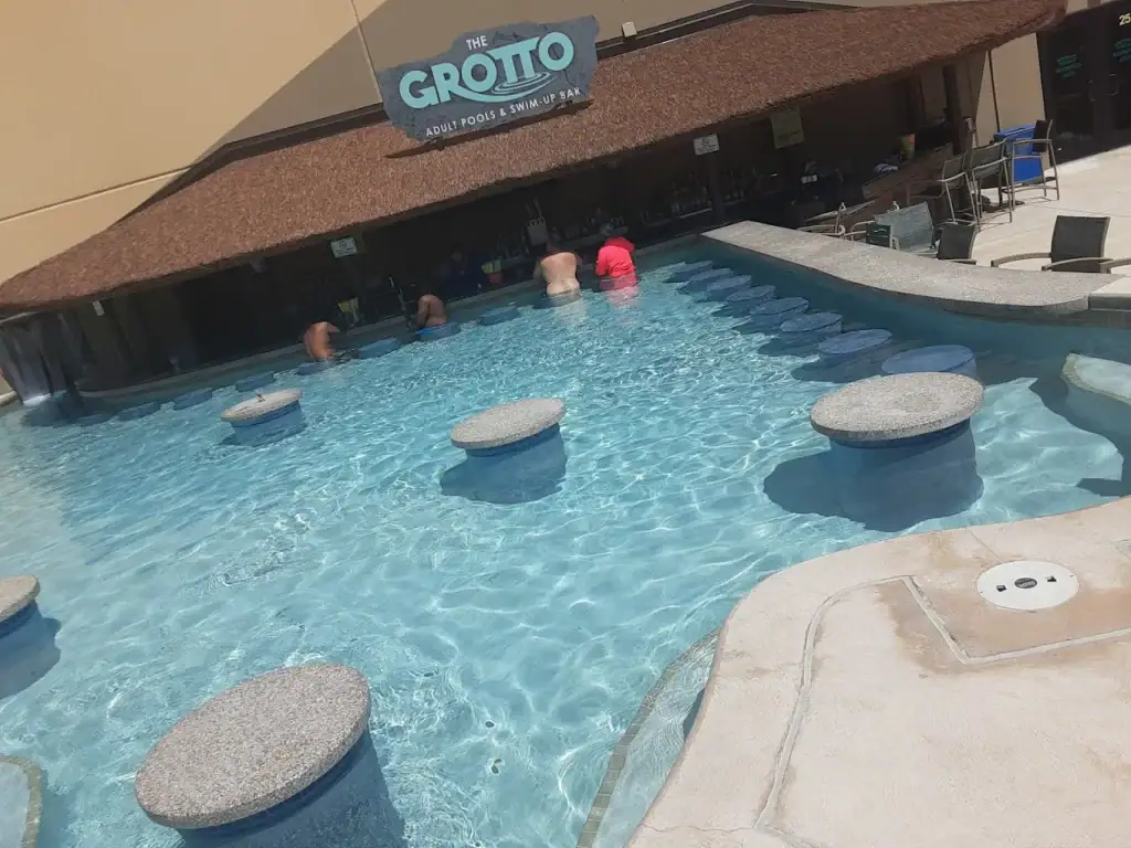 The Grotto offers adults a cave-like swim-up bar, the perfect spot to relax with a drink. Credit: Roy Rdz