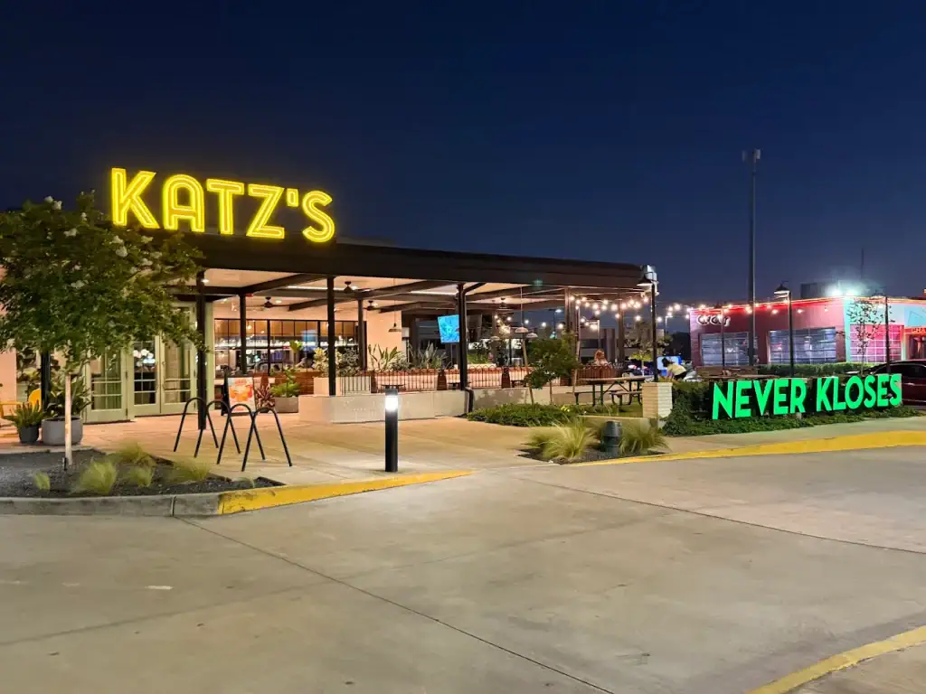 The neon glow of Katz’s Never Kloses shines bright—open 24 hours, you simply can’t miss it. Credit: Farrah Danielle