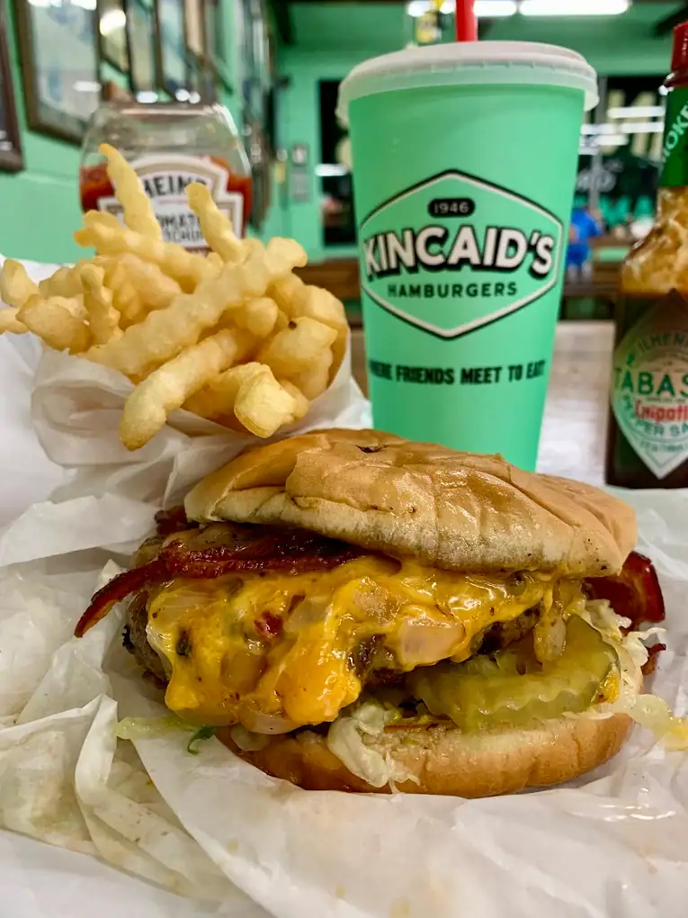 The bacon cheeseburger at Kincaid’s, paired with crinkle-cut fries, is a classic indulgence done right. Credit: David Mccrory