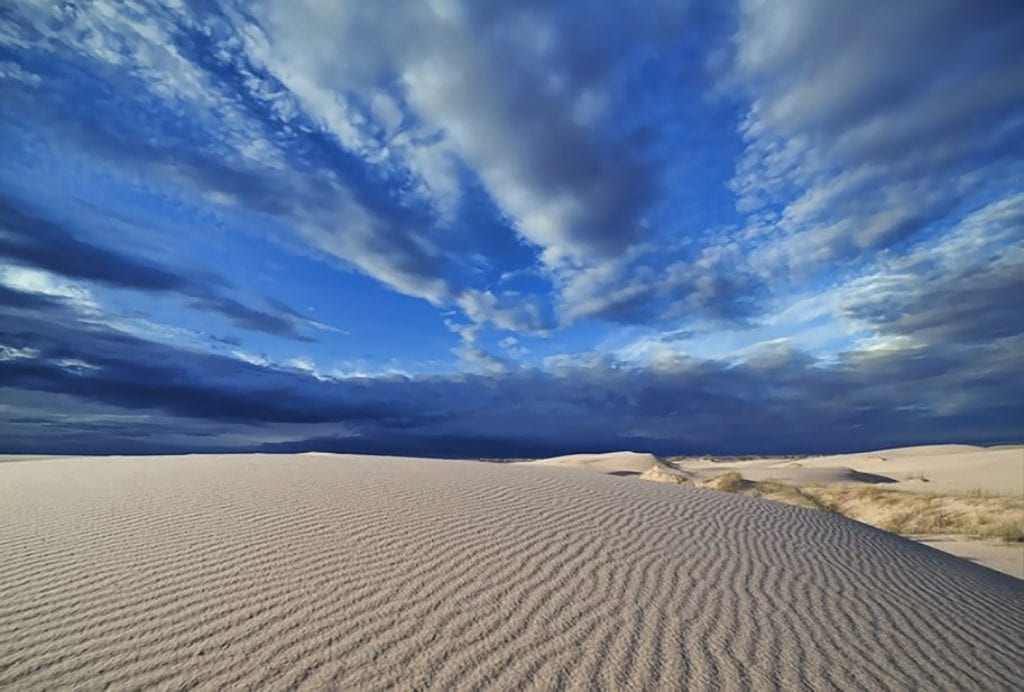 Vast sand dunes stretching beneath an open sky at Monahans Sandhills State Park—West Texas at its most surreal. Credit: @traces_of_texas via Instagram