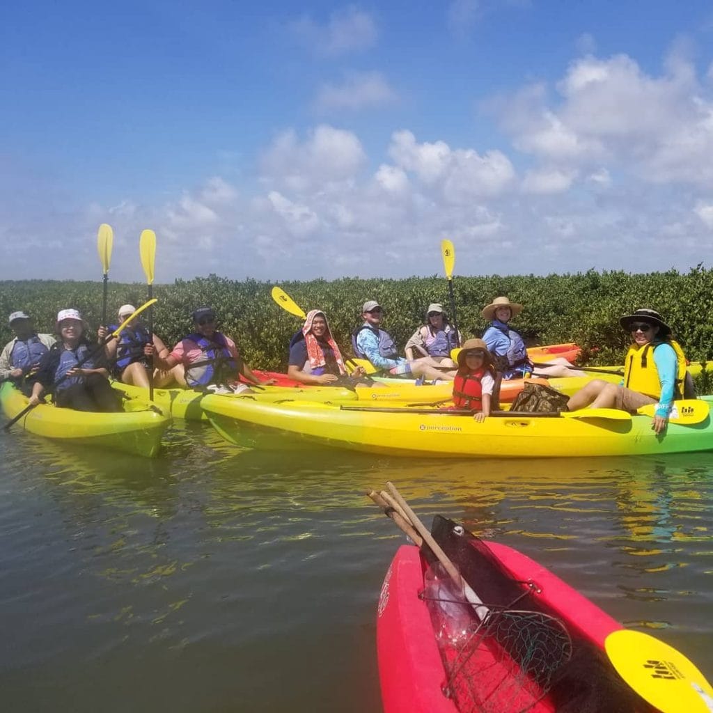 Locals kayaking along Mustang Island State Park, taking advantage of calm coastal waters. Credit: @mustangislandstatepark via Instagram
